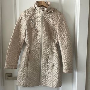 Laundry light weight jacket. Can zip up rain hood attached or leave it out.